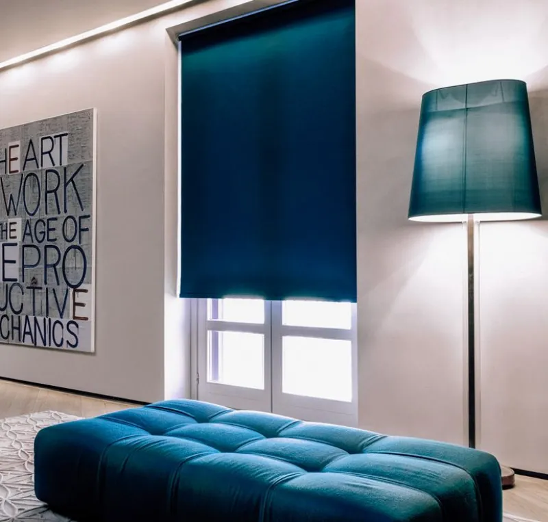 Blackout blinds Dubai fitted in tall glass window